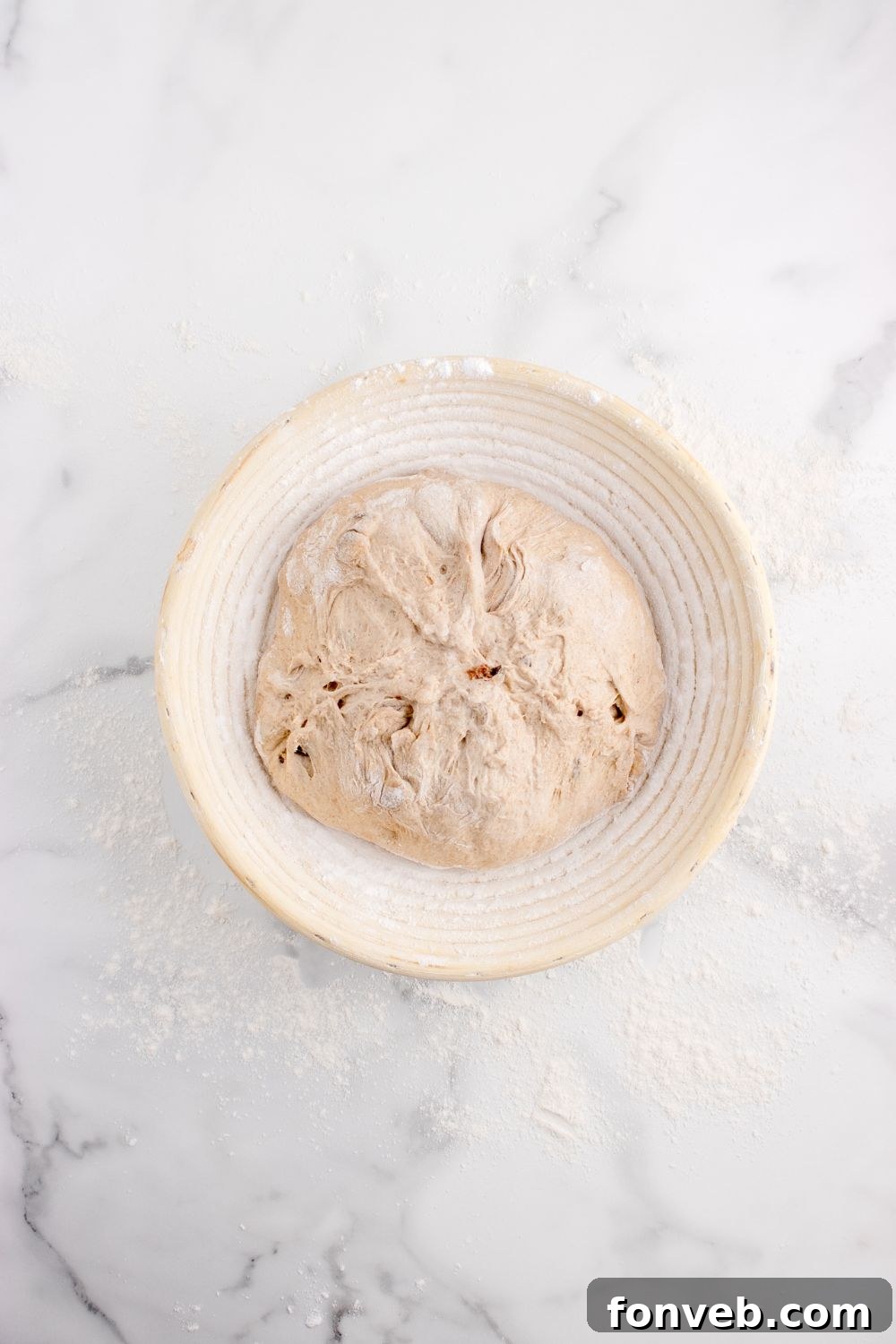 bread dough in a bowl on table for raisin bread 