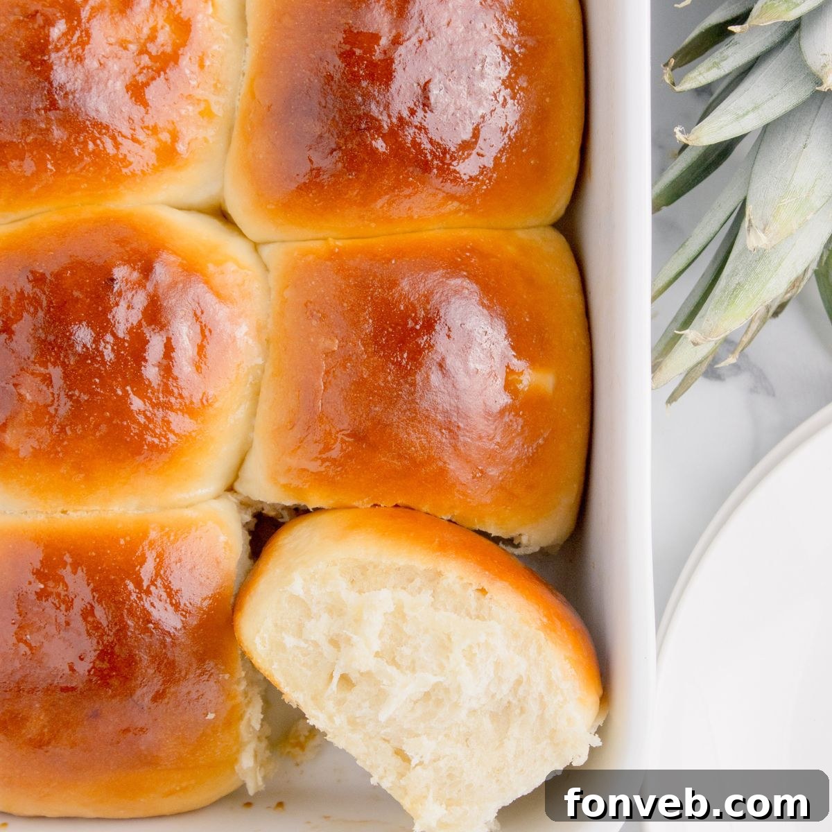 Tropical Dinner Buns 2 Hawaiian Dinner Rolls in a pan showing how fluffy they are