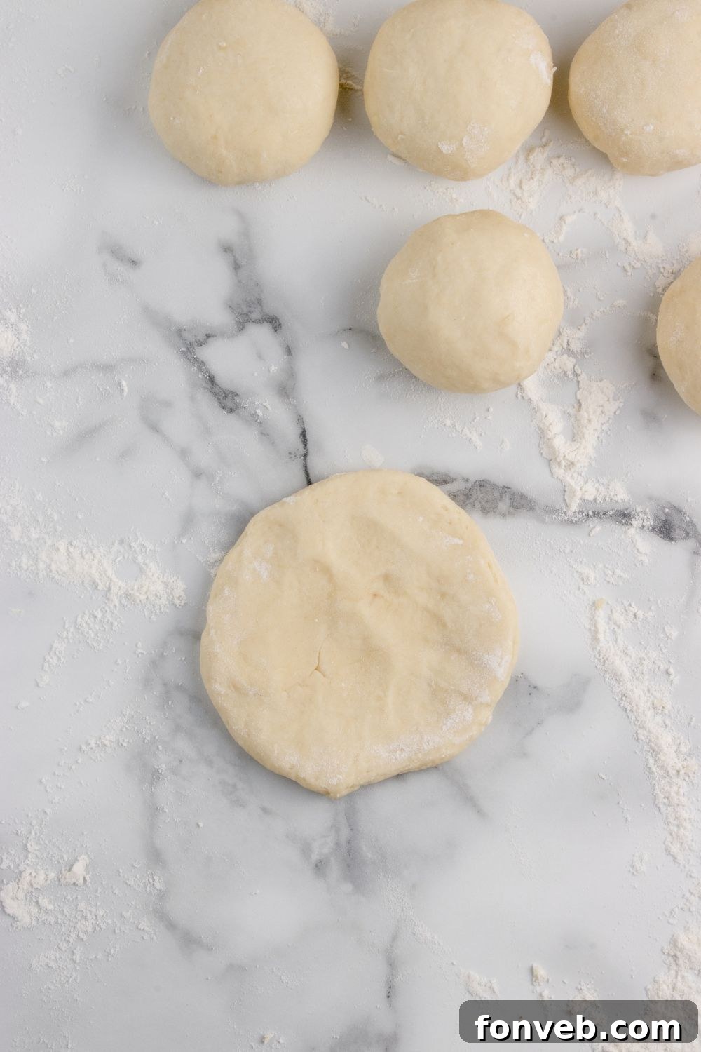 Tropical Dinner Buns 11 round dough for making rolls on table