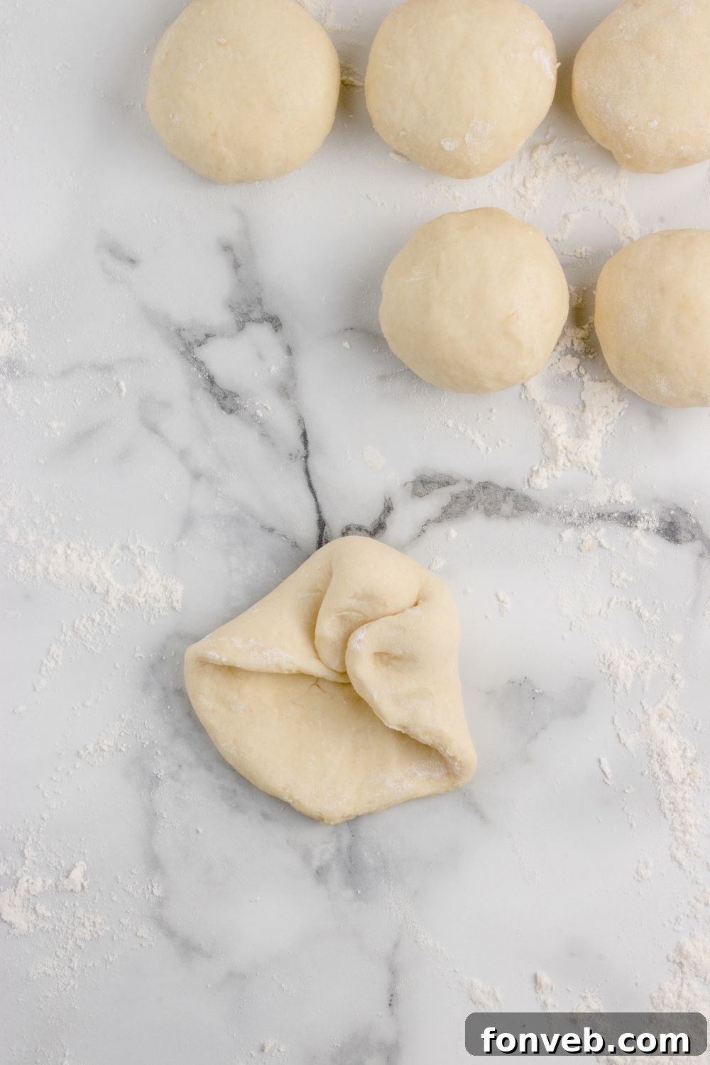 Tropical Dinner Buns 12 folding up bread dough in balls for making Hawaiian rolls