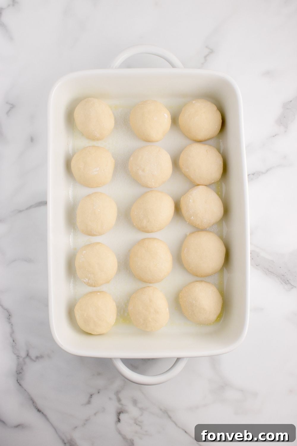 Tropical Dinner Buns 13 Hawaiian rolls dough in a baking dish on counter in a baking dish