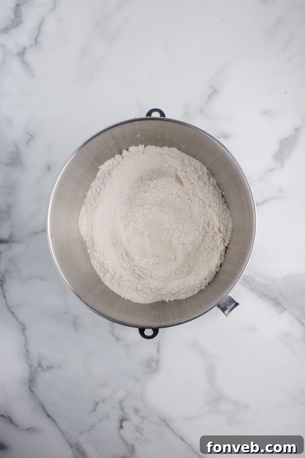 Tropical Dinner Buns 8 flour in a mixing bowl on table for making Hawaiian rolls