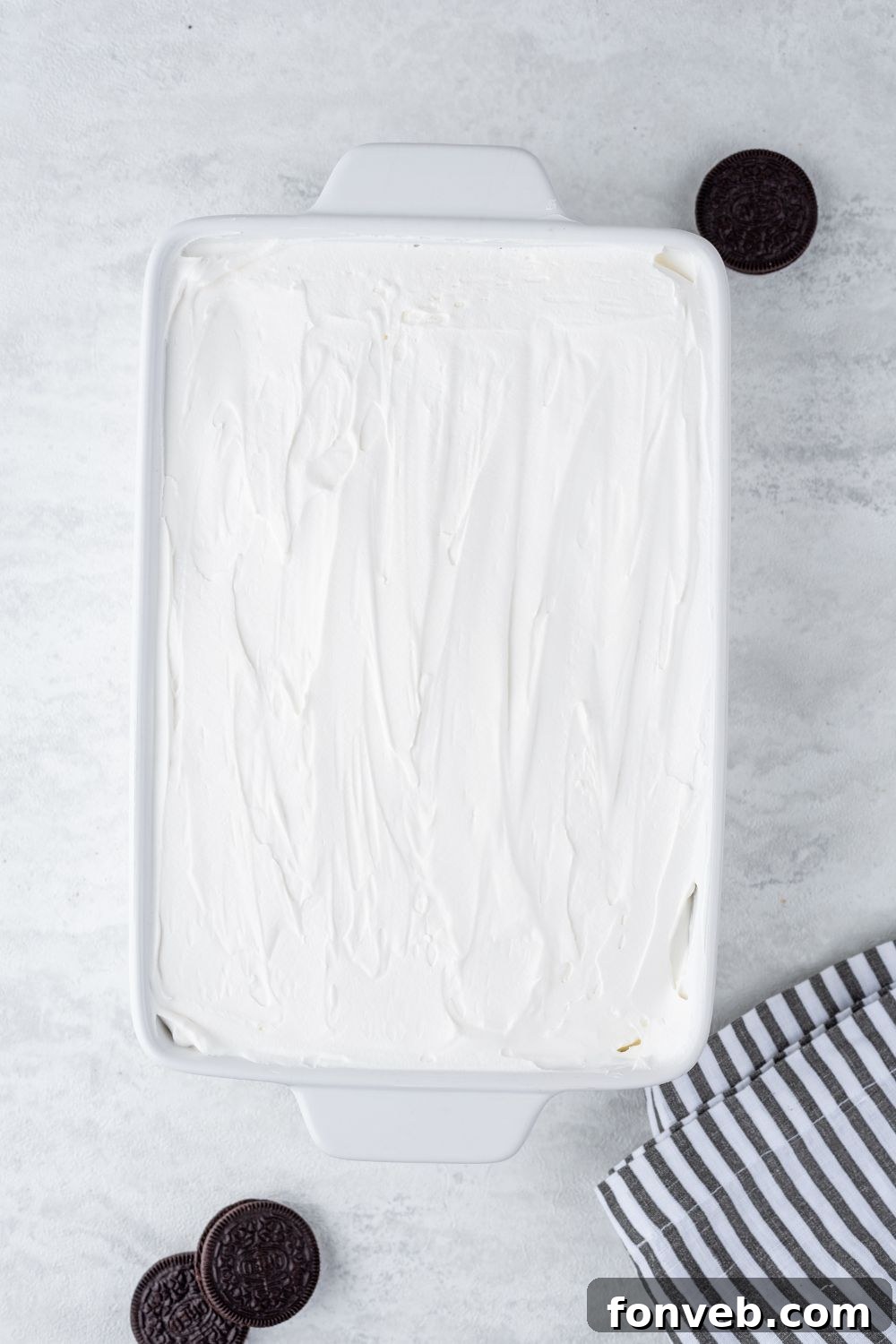 Ultimate Chocolate Oreo Delight 10 An overhead view of the complete Chocolate Oreo Lush dessert in a casserole pan, showing all the distinct, vibrant layers before chilling.