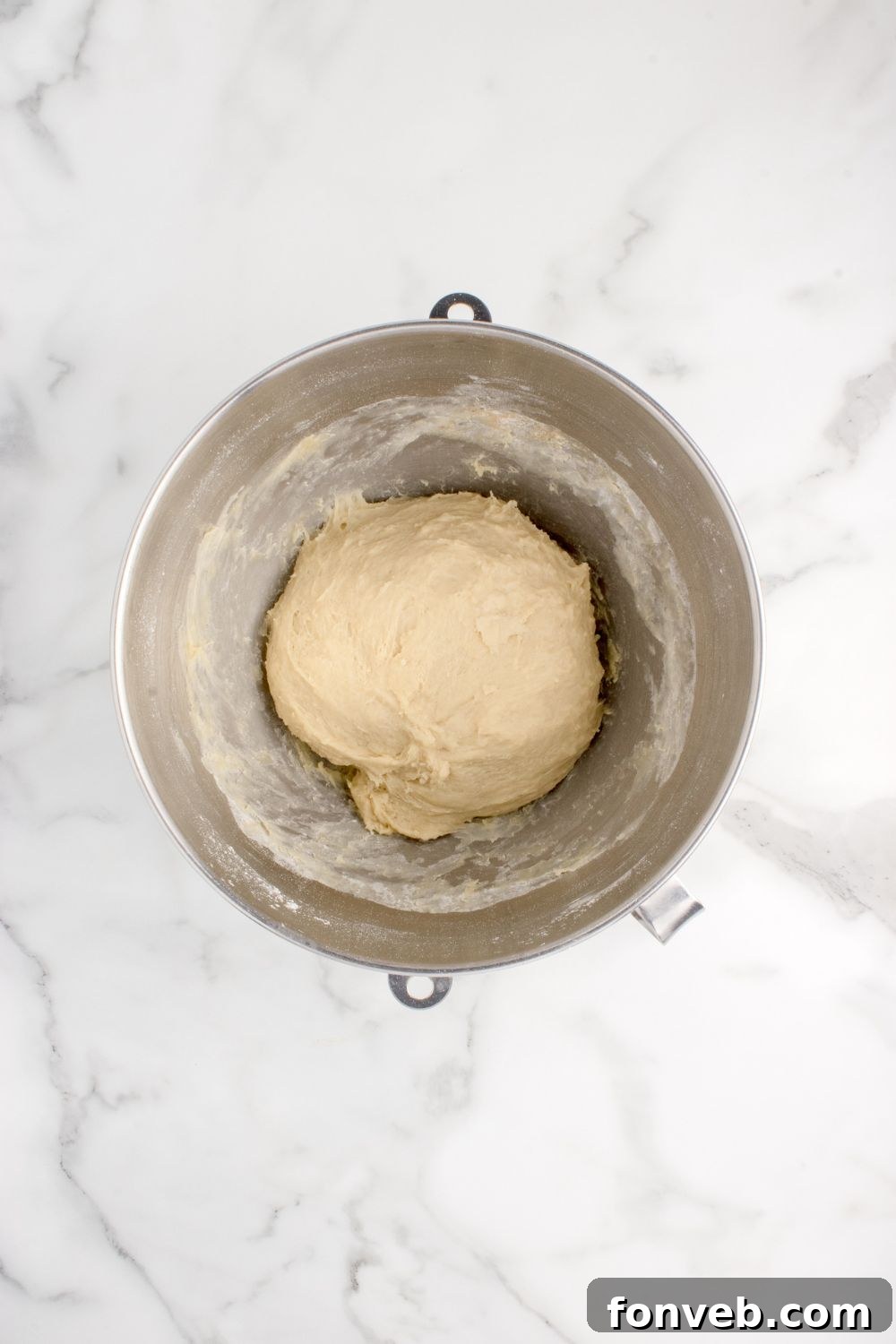 pull apart roll dough formed into a ball in a mixing bowl