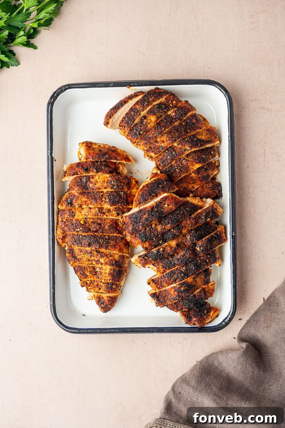 Cajun Chicken Alfredo 10 blackened chicken on a platter that is sliced into strips sitting on table