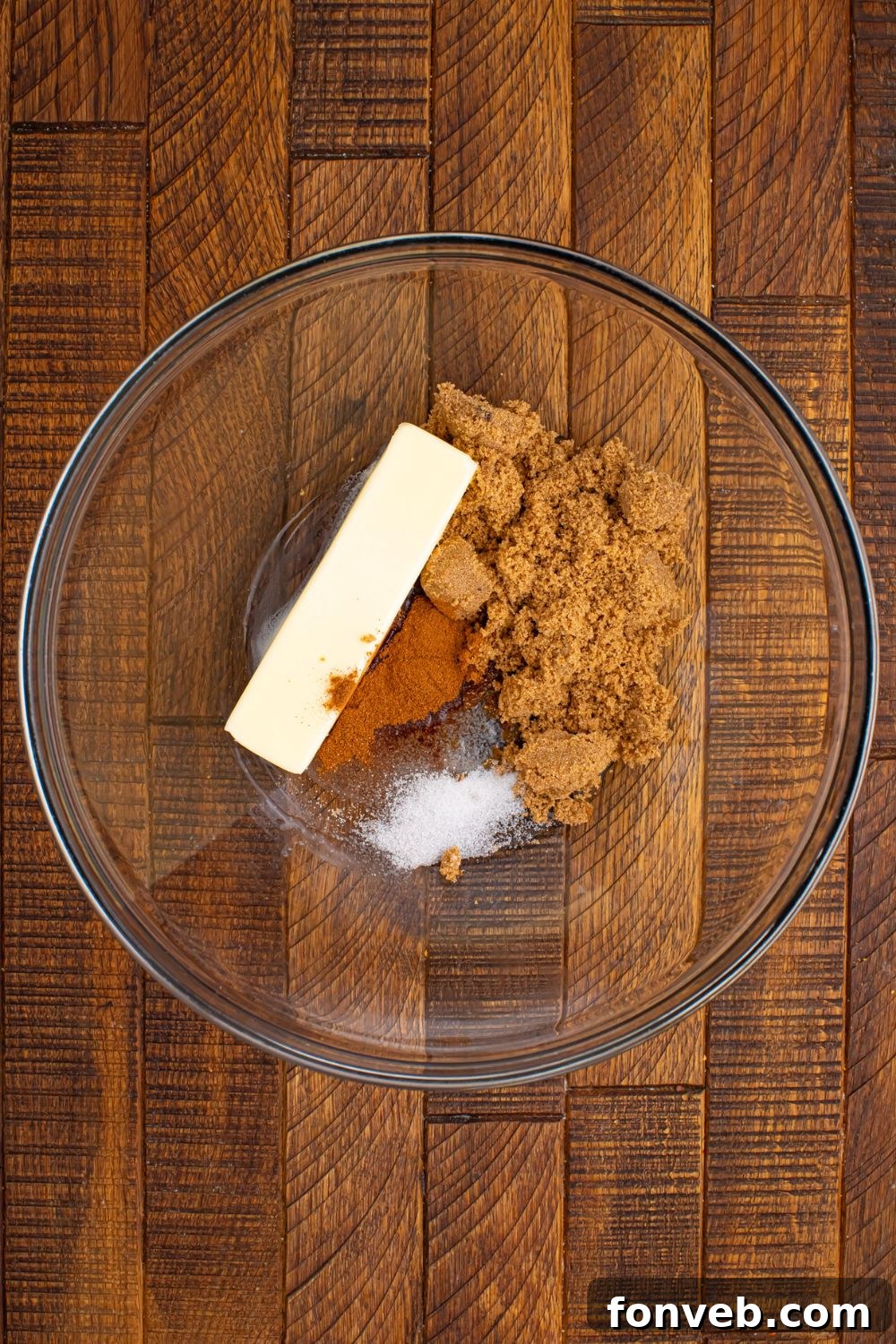 glass bowl with butter, brown sugar, cinnamon and salt in it