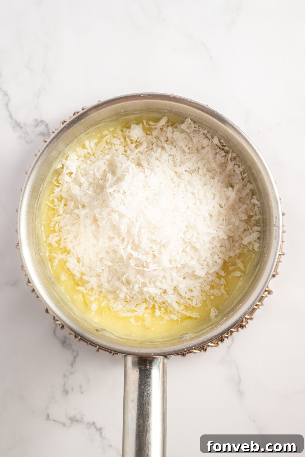 filling for a Coconut Meringue Pie in a saucepan