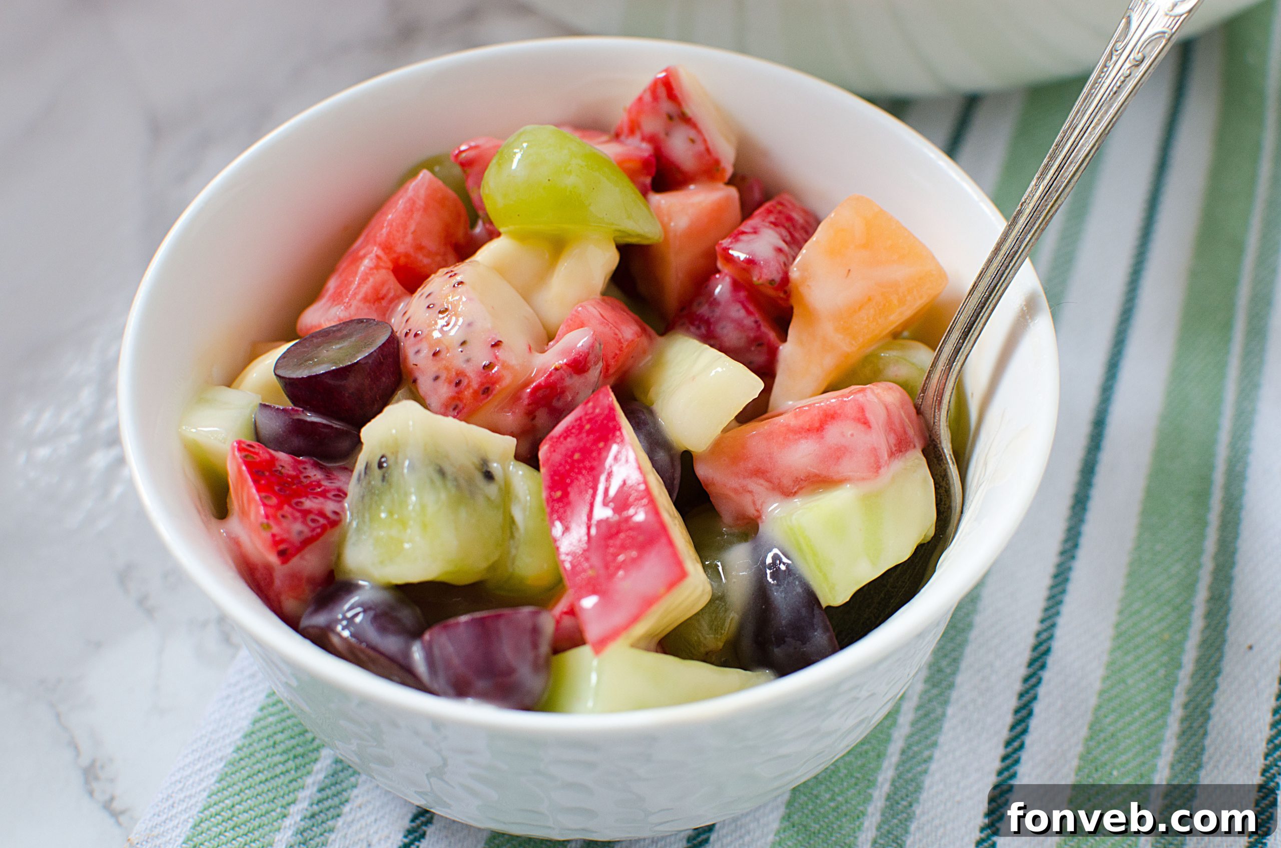 An overhead view of the fruit salad in a large serving bowl, highlighting the fresh and appealing presentation.