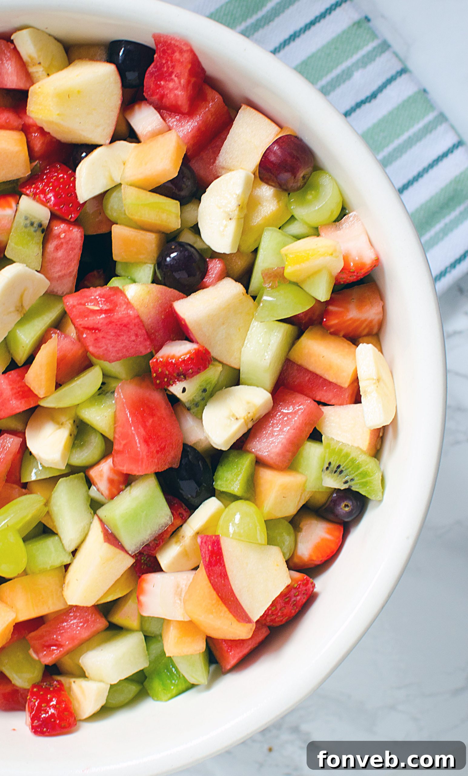 A final, refreshing close-up of the fruit salad, capturing its vibrant appeal and delicious glaze.