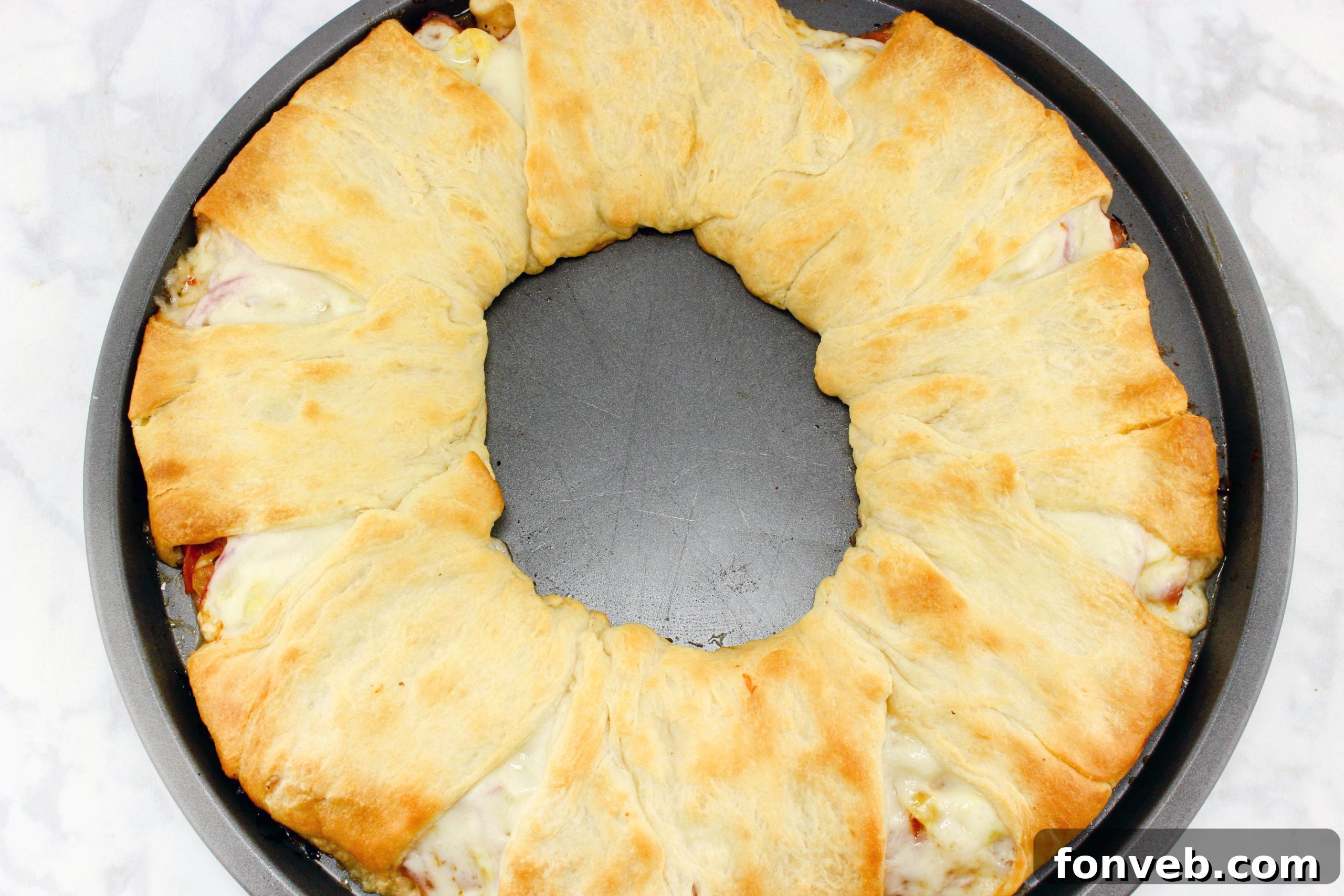 Italian Sub Crescent Bake 6 Assortment of Italian deli meats, including ham, salami, and pepperoni