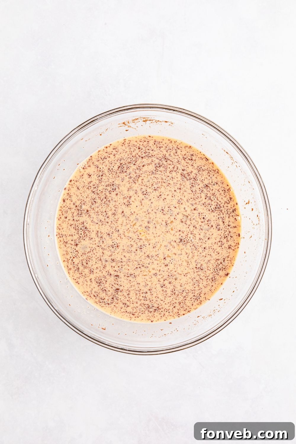 egg custard mixture in a glass bowl for French toast 