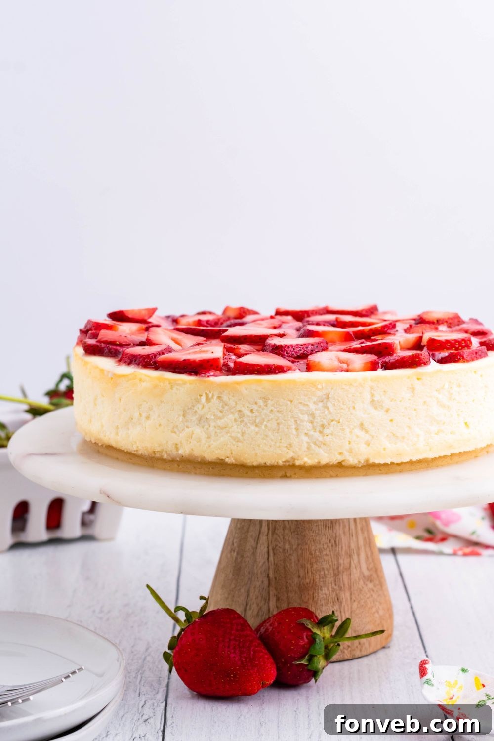Keto Cheesecake on a cake platter on table 