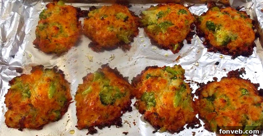 A batch of cheesy broccoli patties cooling on a wire rack, ready to be served