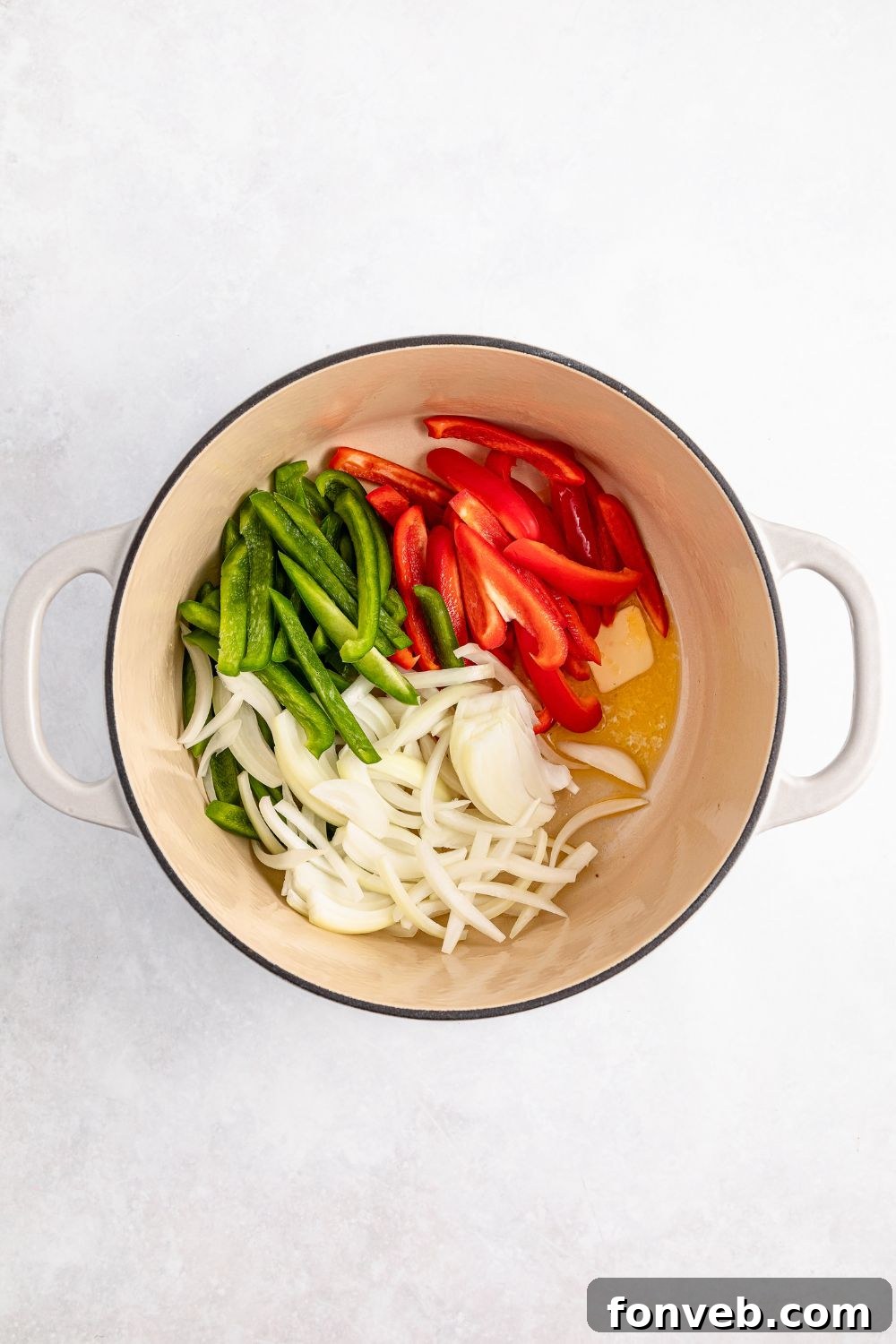 Reggae Ragu 11 peppers and onions in a stock pot with some melted butter for rasta pasta
