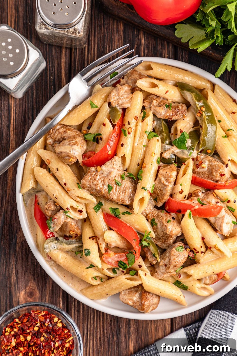 Reggae Ragu 17 overhead shot of Rasta Pasta on a plate with salt and pepper shakers and veggies around plate on table