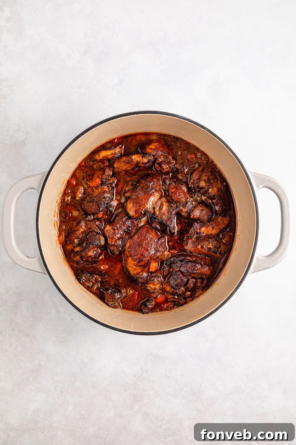 Dutch Oven with cooked Jamaican Brown Stew Chicken  