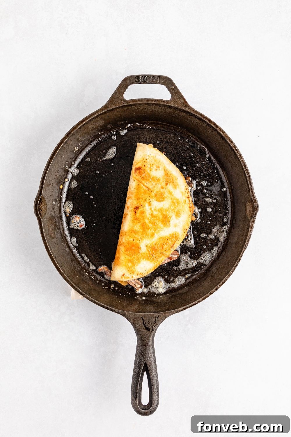 Hearty Mississippi Melt Quesadillas 13 skillet with a Mississippi Pot Roast Quesadilla in it