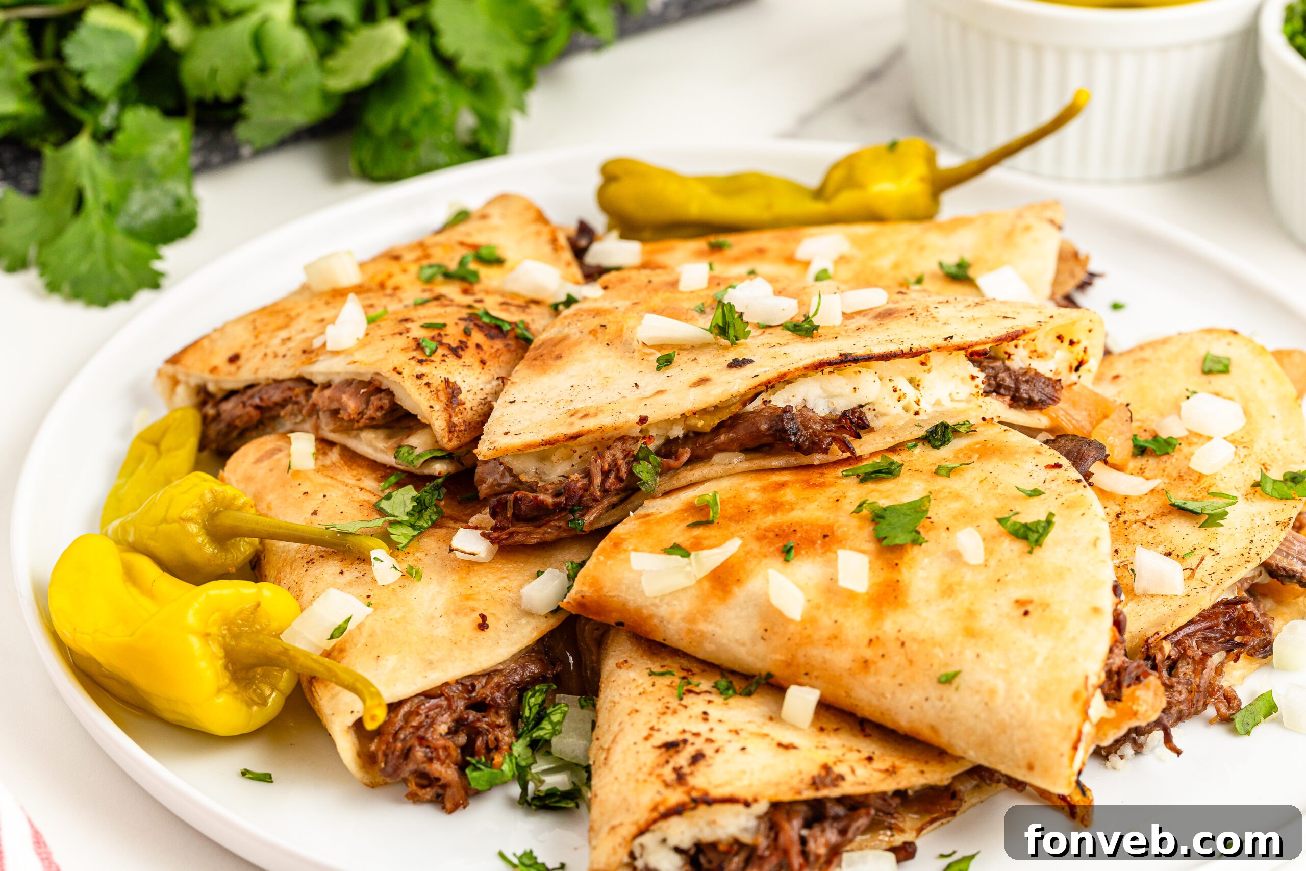 Hearty Mississippi Melt Quesadillas 4 side angle of the Mississippi Pot Roast Quesadillas piled on a plate