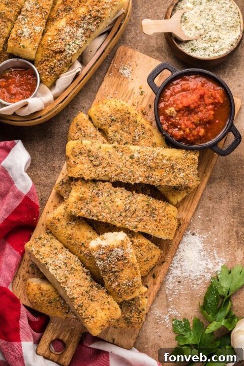 Homemade Pizza Hut Breadsticks 2 overhead shot of Copycat Pizza Hut Breadsticks on a wooden cutting board