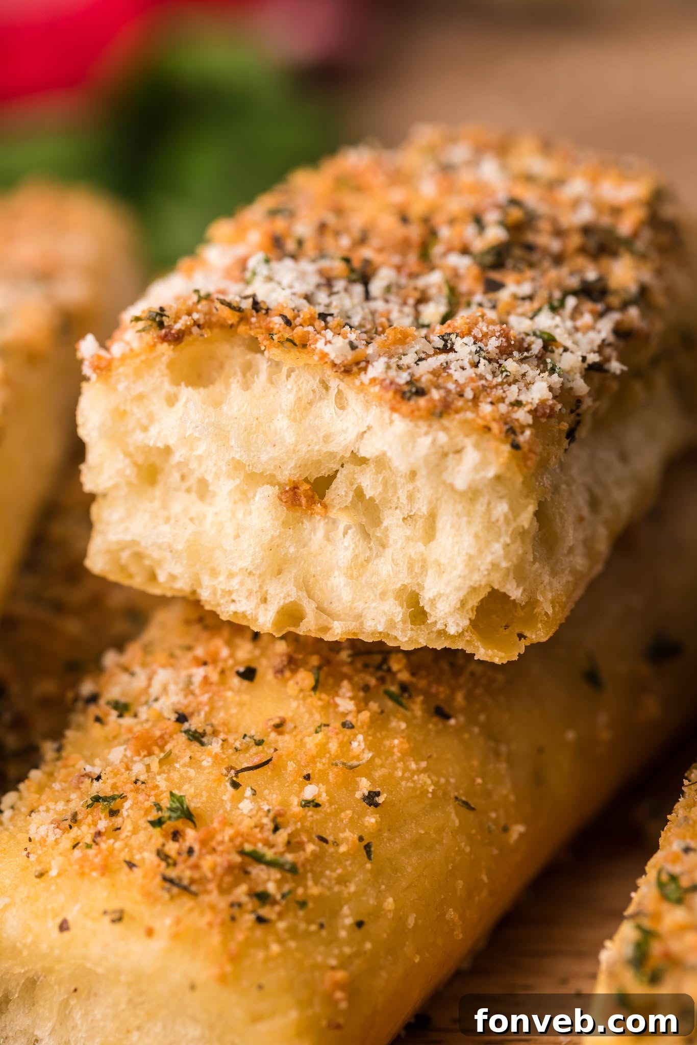 Homemade Pizza Hut Breadsticks 4 up close shot of the Copycat Pizza Hut Breadsticks cut open to show the fluffy inside