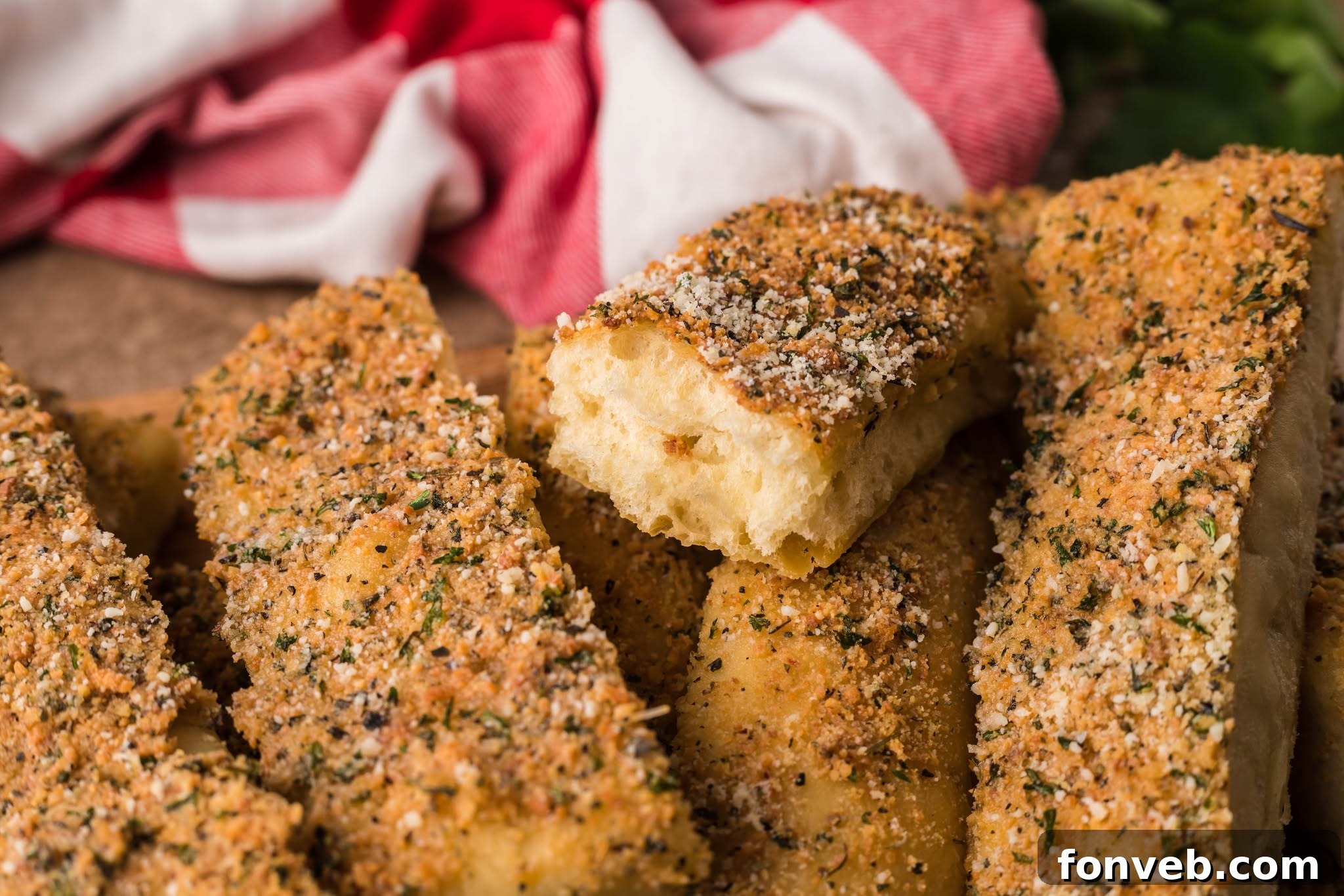 Homemade Pizza Hut Breadsticks 5 Copycat Pizza Hut Breadsticks piled in a wooden basket with one missing a bite