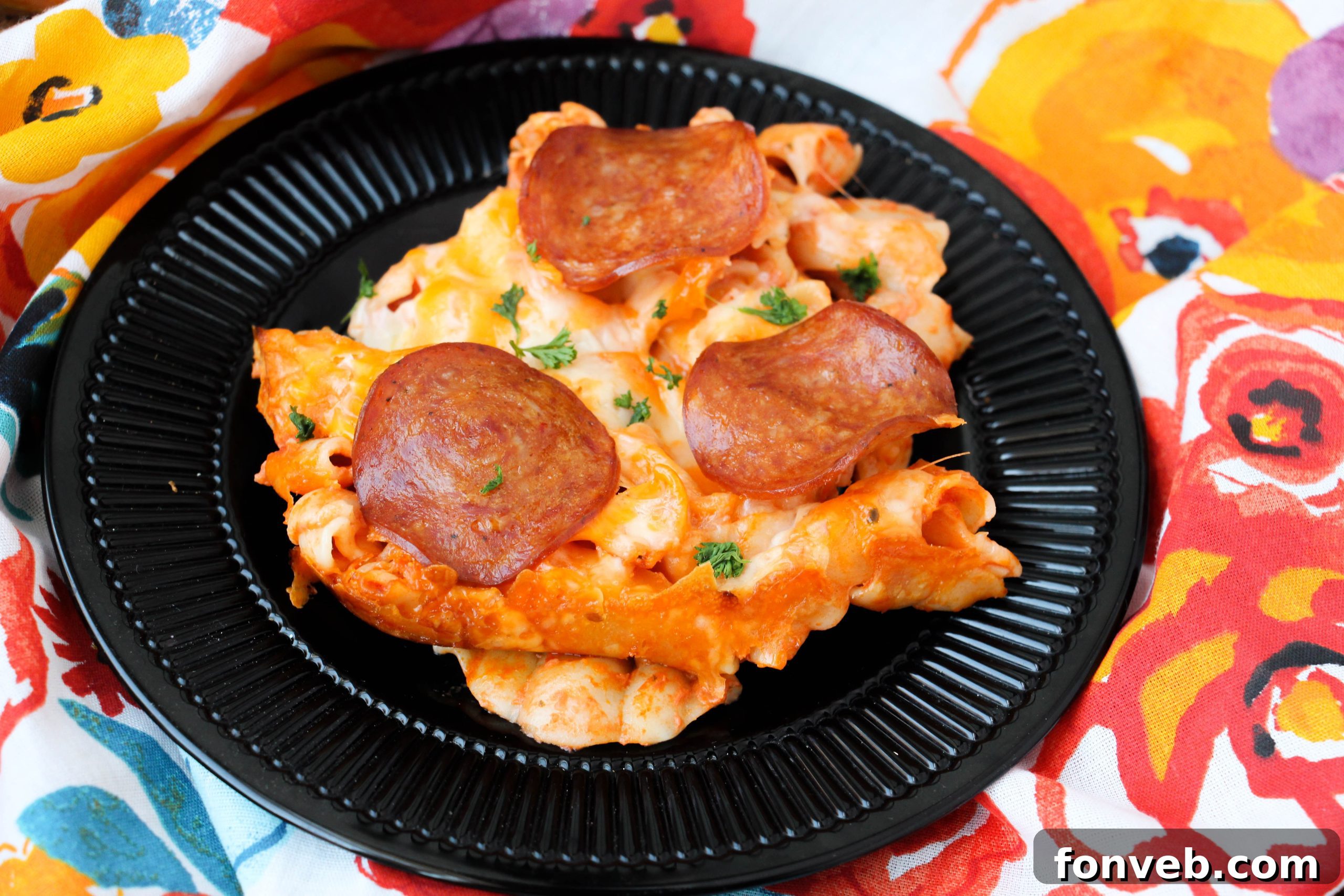 Close-up of golden-brown Pepperoni Pizza Pasta Bake with bubbly cheese and crispy pepperoni slices