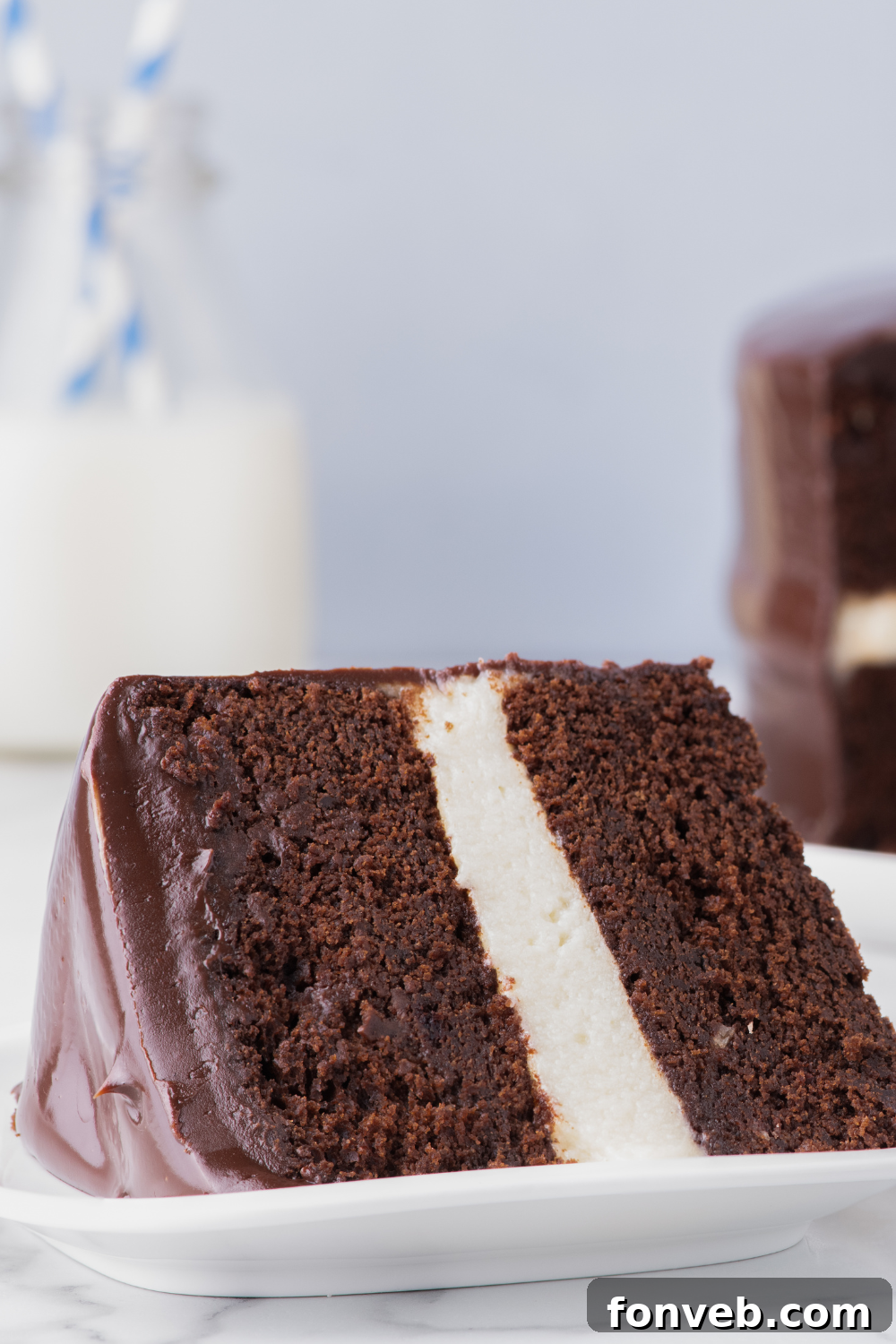 Decadent Chocolate Cream Dream 12 A beautifully presented slice of Ding Dong Cake on a plate, elegantly placed on a table, highlighting its irresistible appeal.