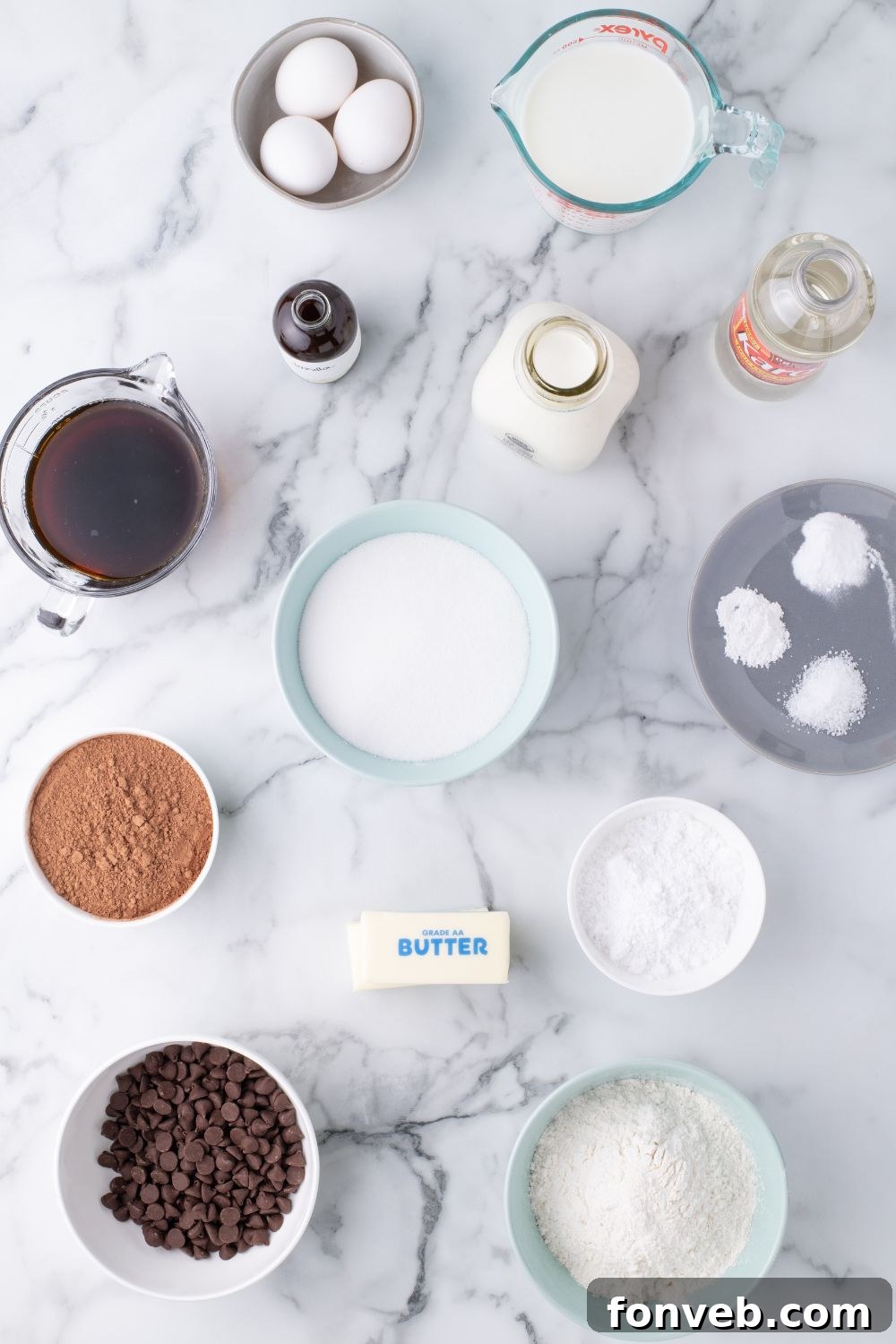 Decadent Chocolate Cream Dream 13 Various ingredients for Ding Dong Cake meticulously arranged in single-serve bowls on a table, ready for baking.