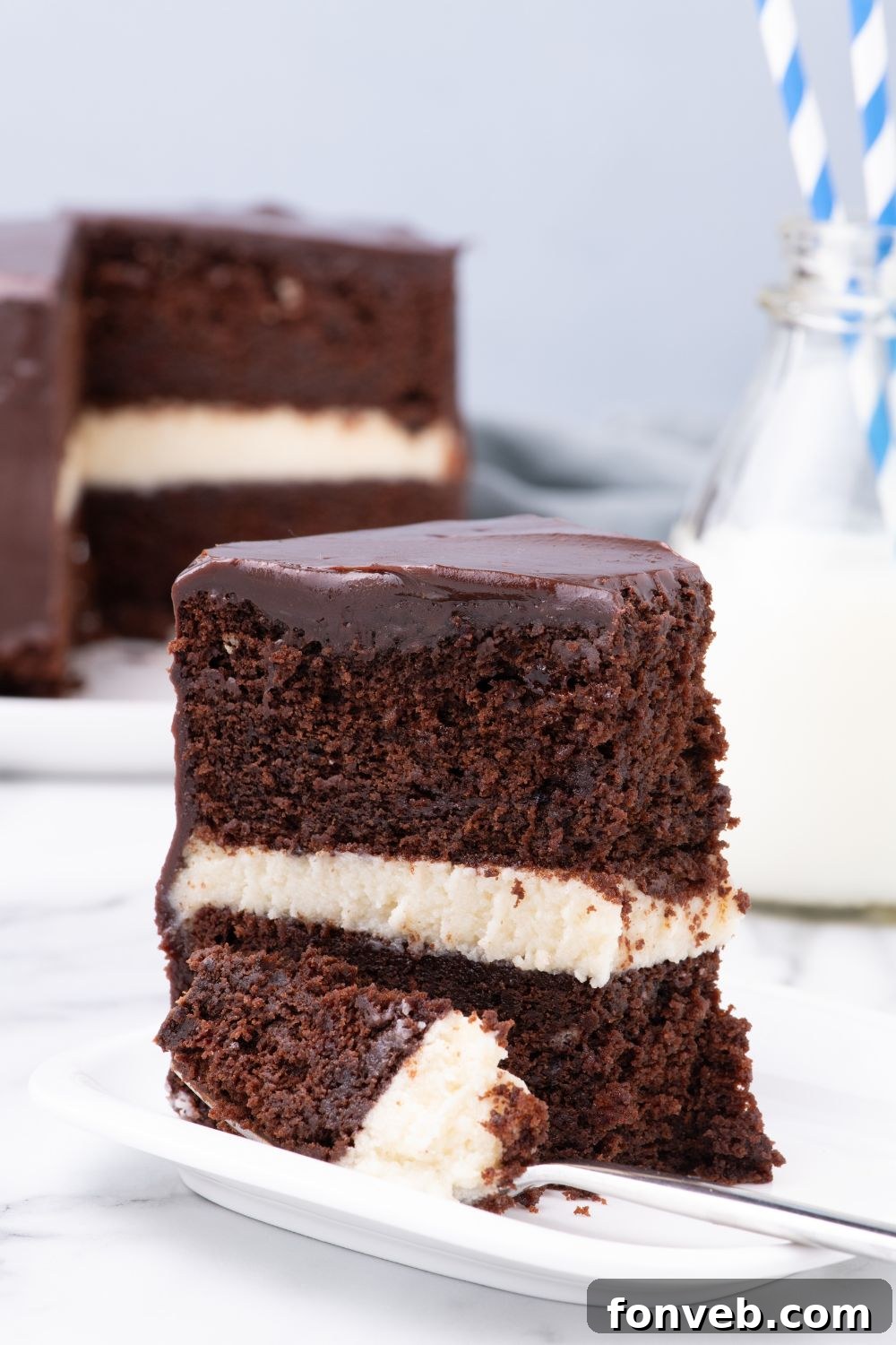 Decadent Chocolate Cream Dream 22 A delightful slice of Ding Dong Cake on a plate, with a satisfying bite taken out, showcasing its delicious layers and texture.