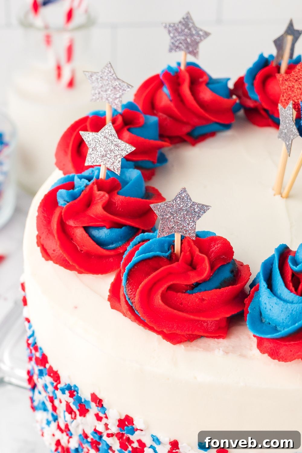 American Flag Cake on table with close up to see stars poked into cake with toothpicks 