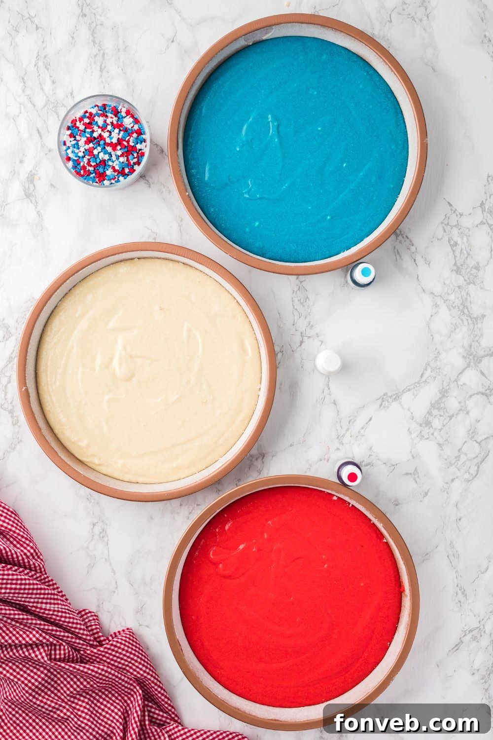 cake batter in round cake pans sitting on table 