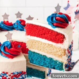 American Flag Layered Cake with a slice being lifted out with spatula