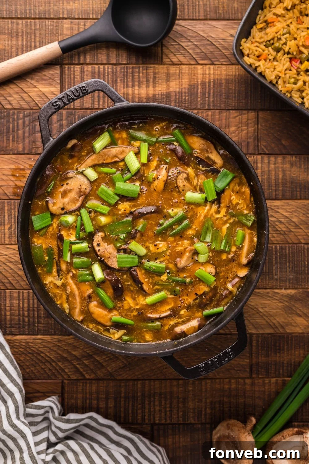 PF Chang's Fiery & Tangy Soup 11 PF Changs Hot And Sour Soup in a pot on table with spoon and towel by it