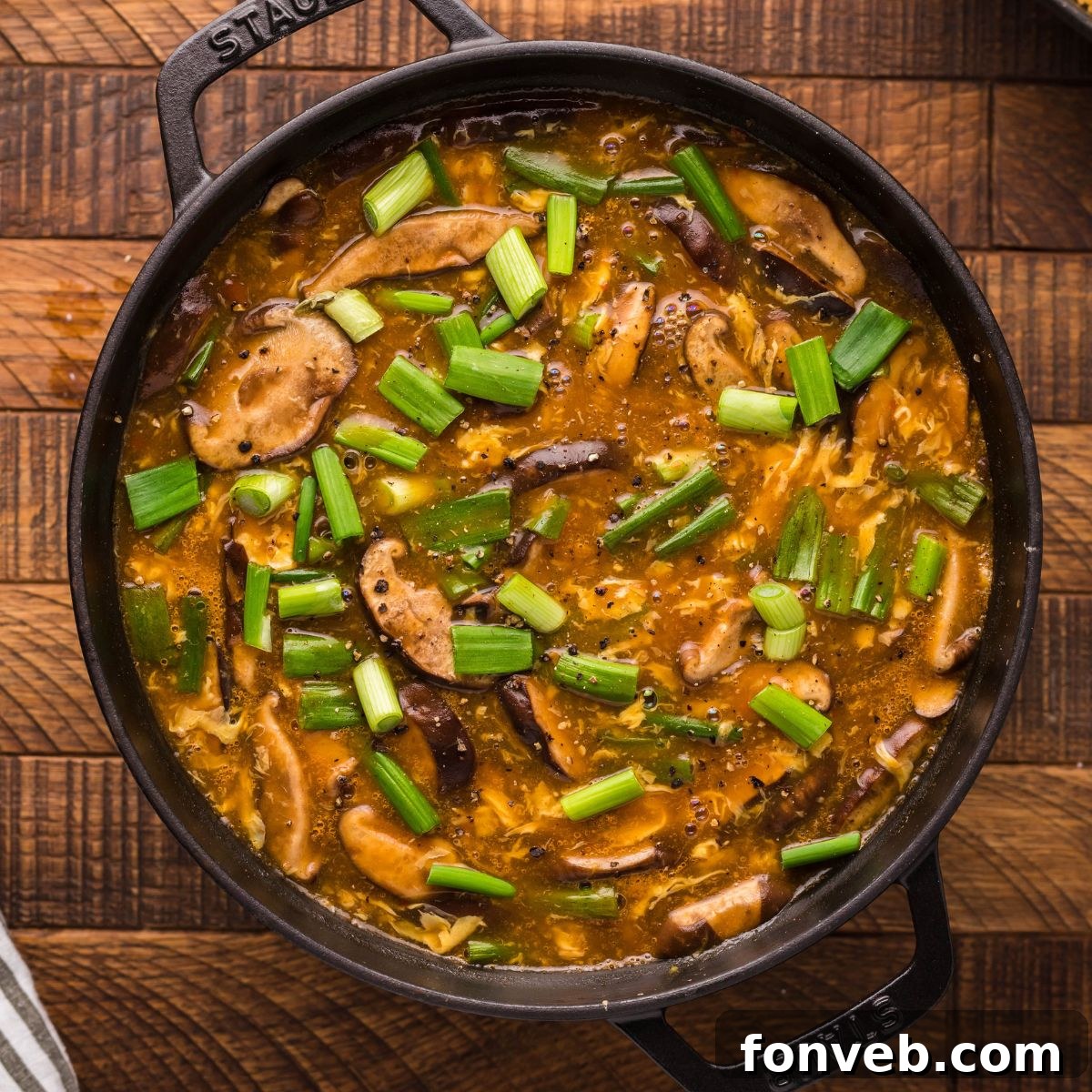 PF Chang's Fiery & Tangy Soup 3 PF Changs Hot And Sour Soup in a pan on a wooden table