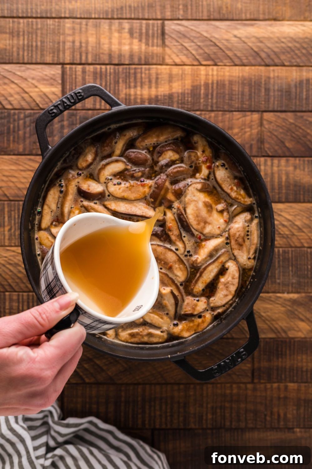 PF Chang's Fiery & Tangy Soup 9 broth being poured into pot for making PF Changs Hot And Sour Soup