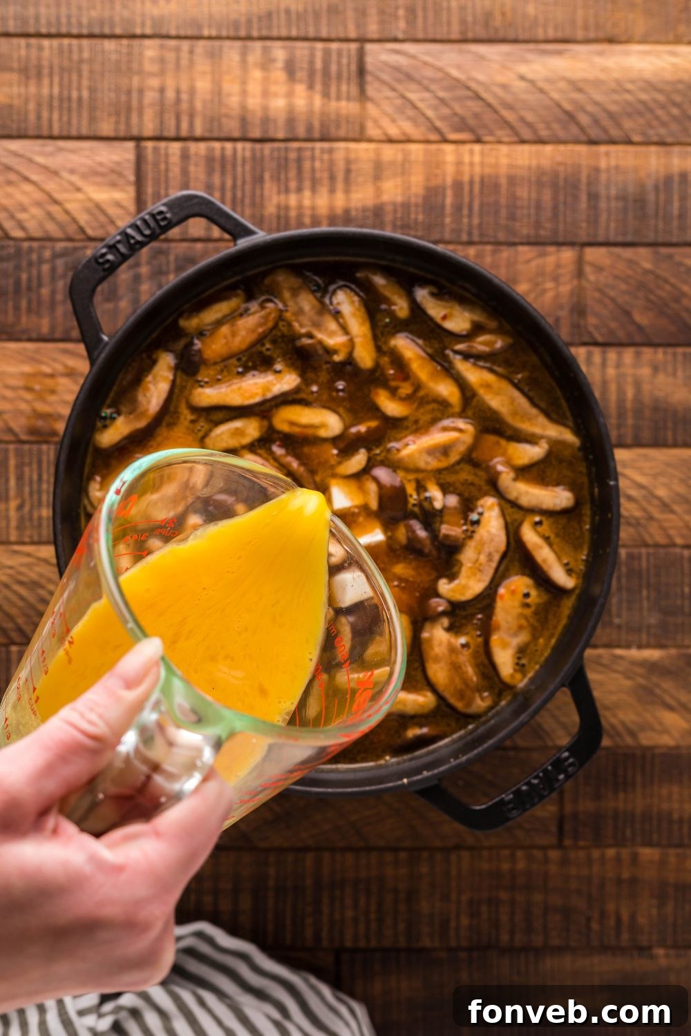 PF Chang's Fiery & Tangy Soup 10 PF Changs Hot And Sour Soup being made in a pot with eggs pouring into soup