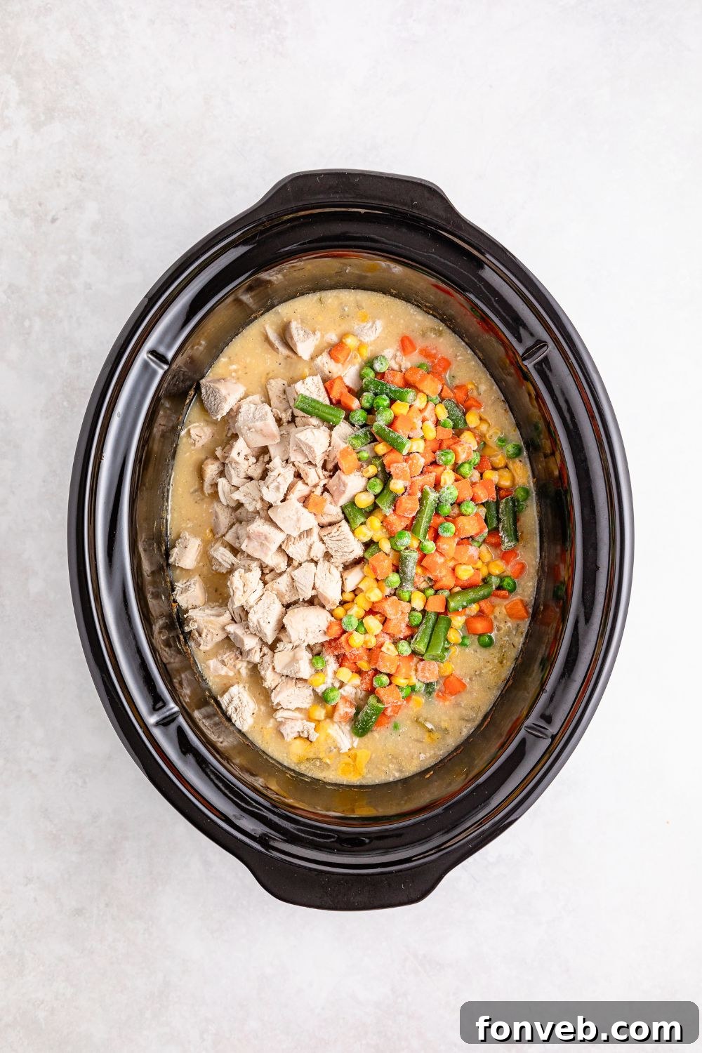 Easy Slow Cooker Chicken Pot Pie 12 cooked Slow Cooker Chicken Pot Pie in slow cooker on table