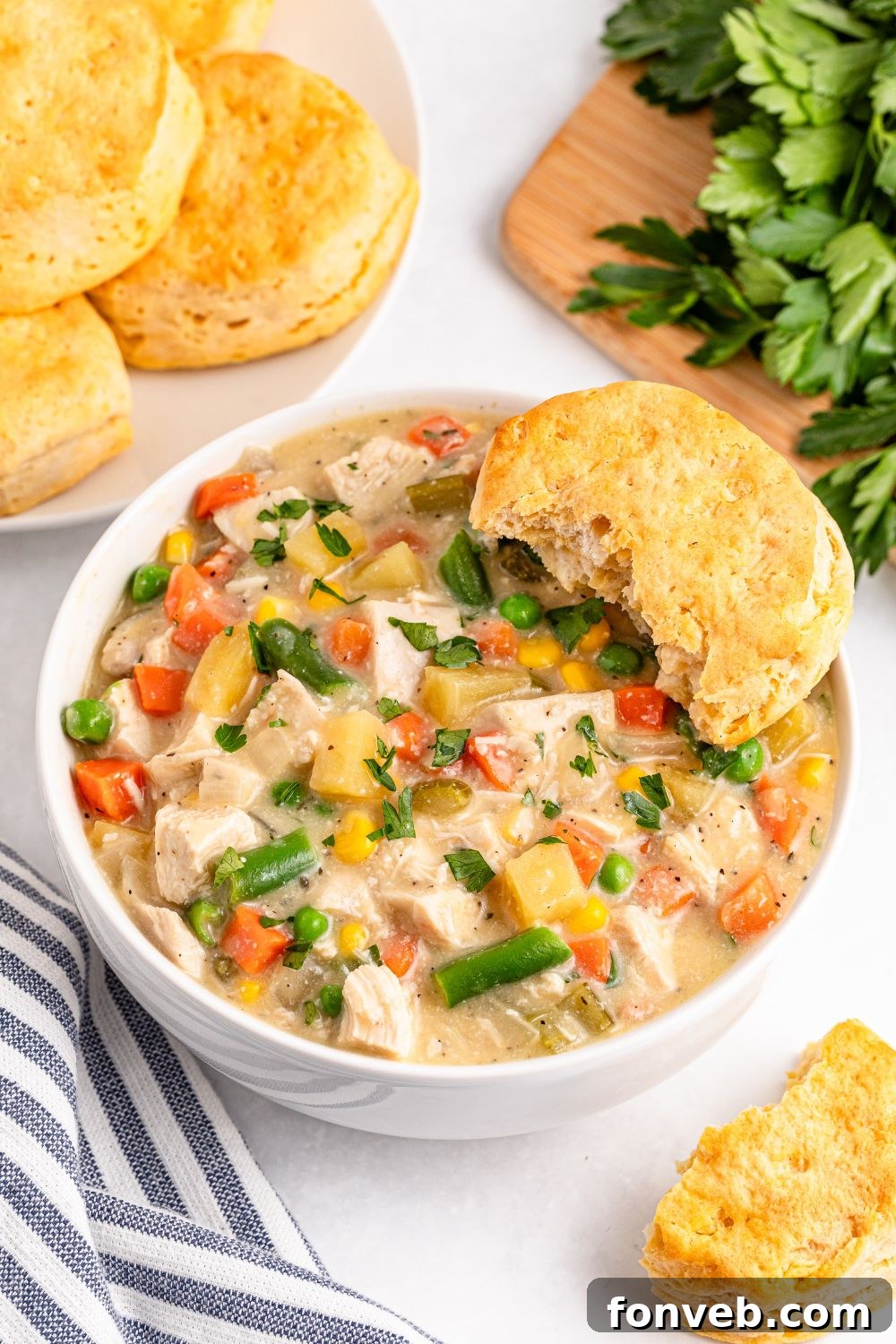 Easy Slow Cooker Chicken Pot Pie 17 Slow Cooker Chicken Pot Pie in a bowl with biscuits on the side
