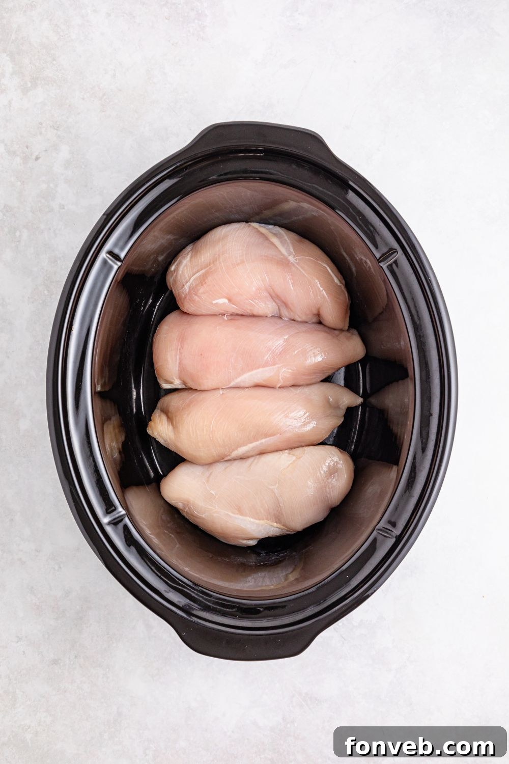 Easy Slow Cooker Chicken Pot Pie 8 raw chicken breast in slow cooker on table