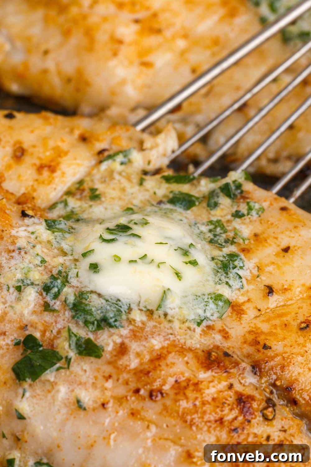 Golden Pan-Seared Tilapia 12 Pan Fried Tilapia with a skillet on side scooping it up