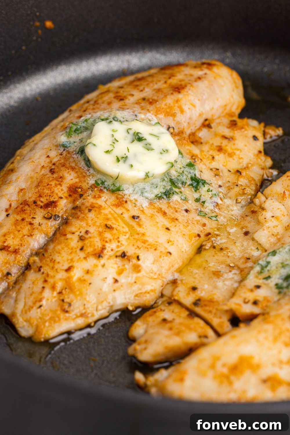 Golden Pan-Seared Tilapia 9 Pan Fried Tilapia in a skillet in a pan