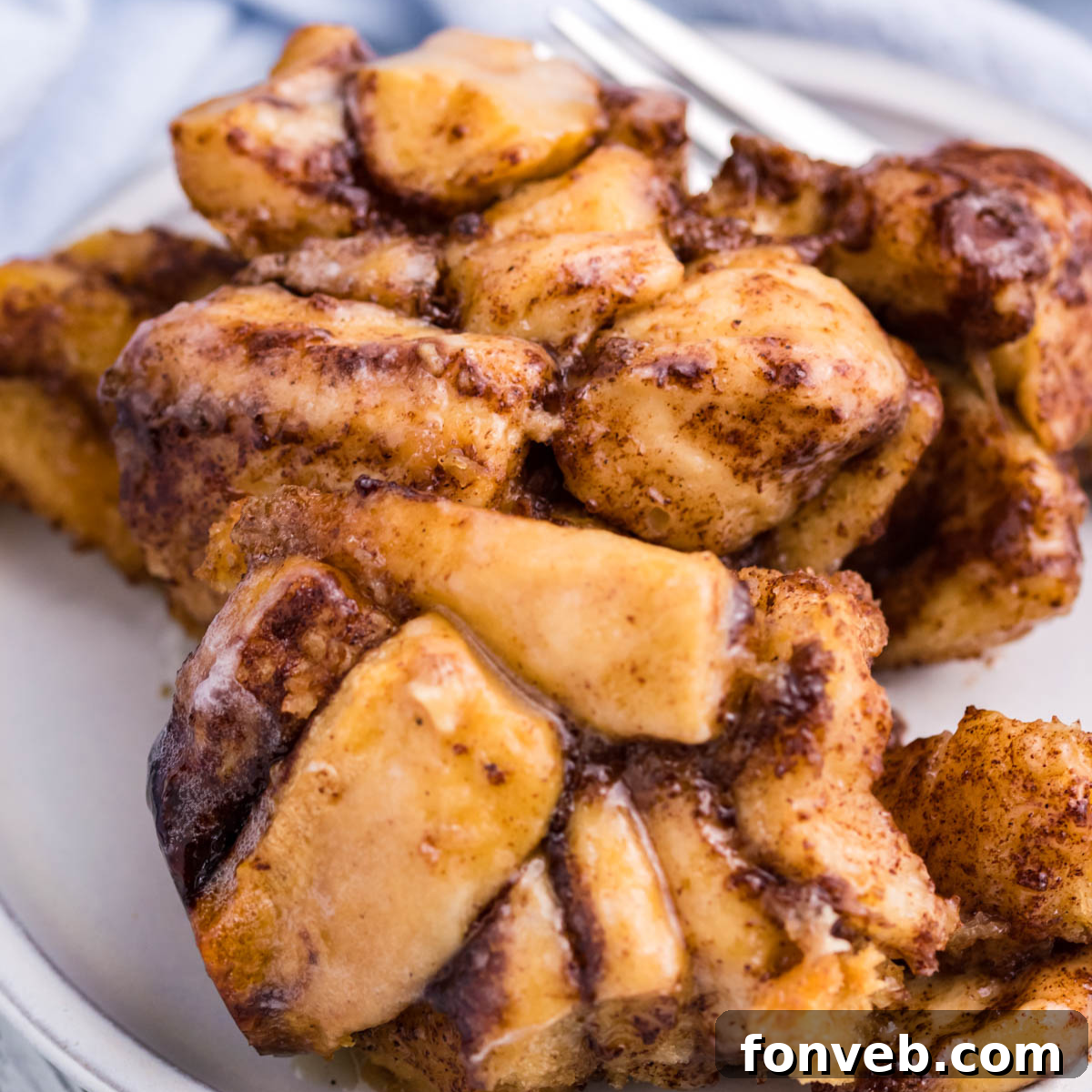 Up close view of the cinnamon sugar on the casserole on a white plate