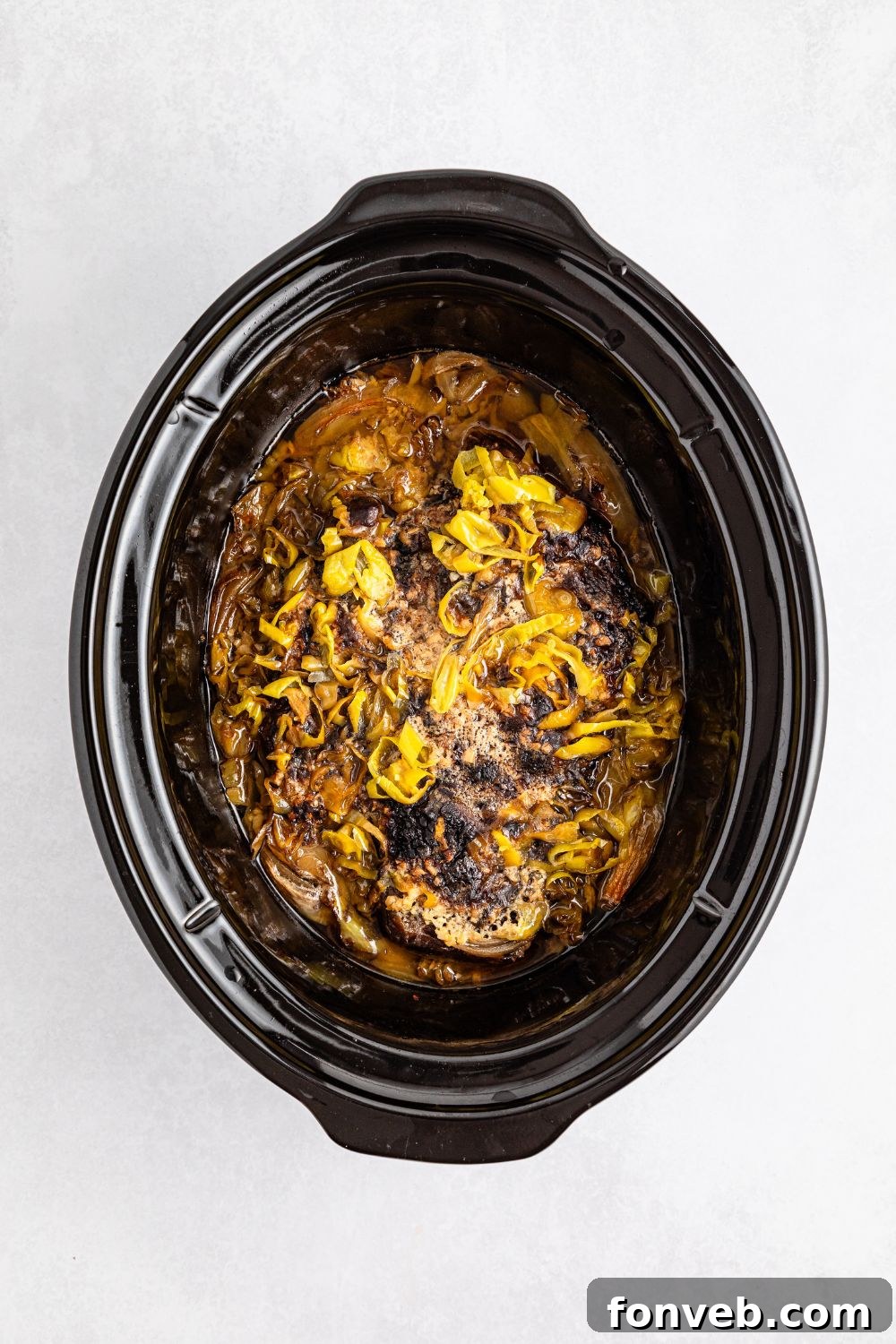 Ultimate Mississippi Pot Roast Sandwiches 13 Cooked pot roast in slow cooker on table