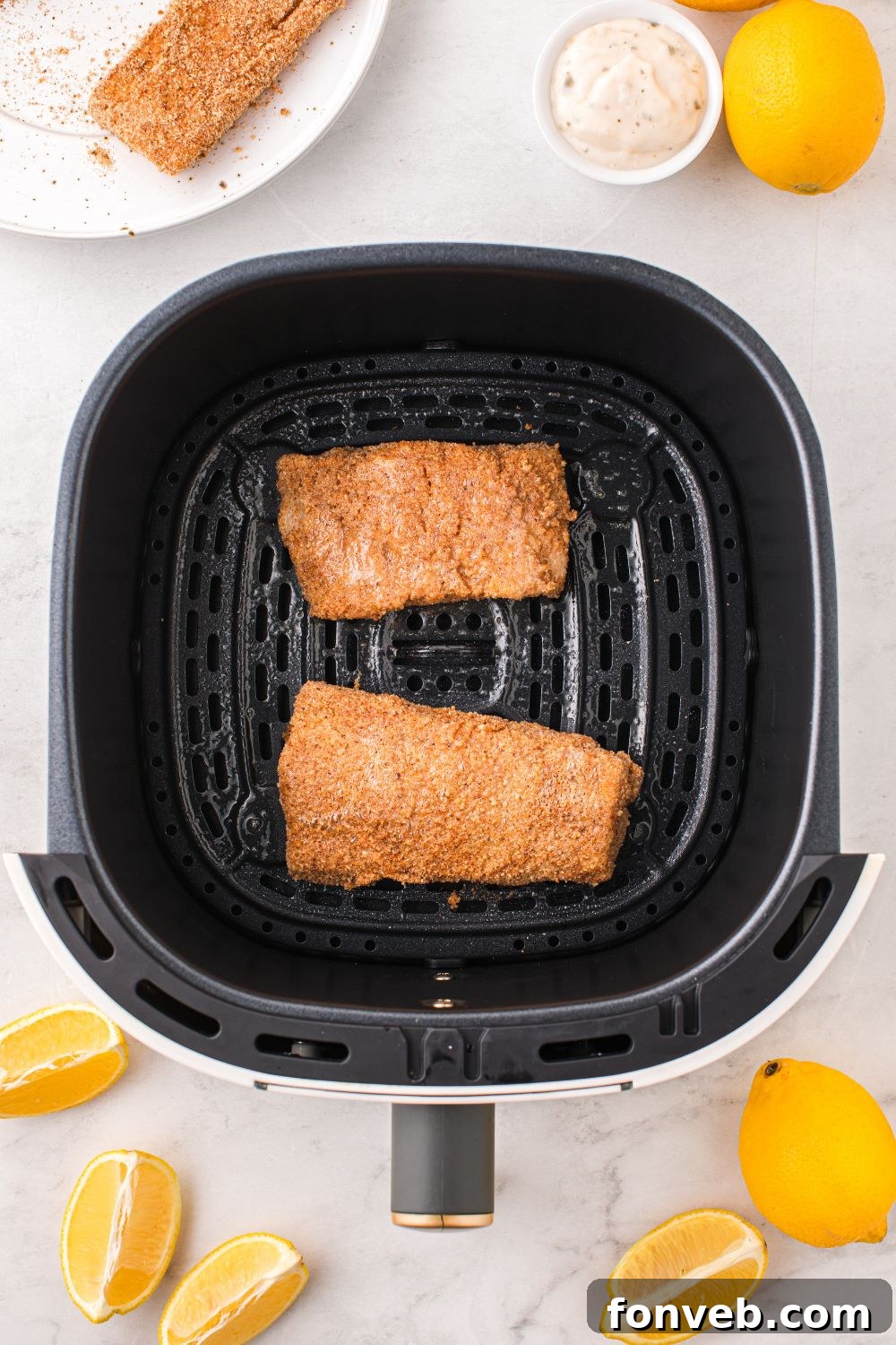 Crispy Air-Fried Fish and Chips 12 raw breaded fish in air fryer basket