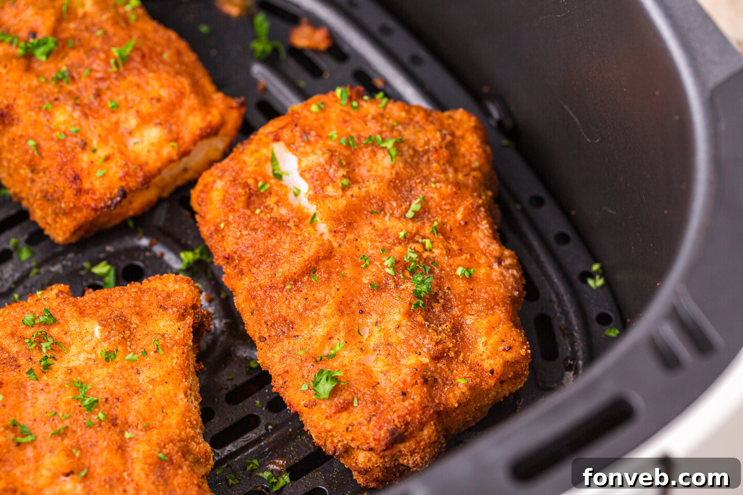 Crispy Air-Fried Fish and Chips 16 Up close shot of the Air Fryer Fish inside the air fryer basket