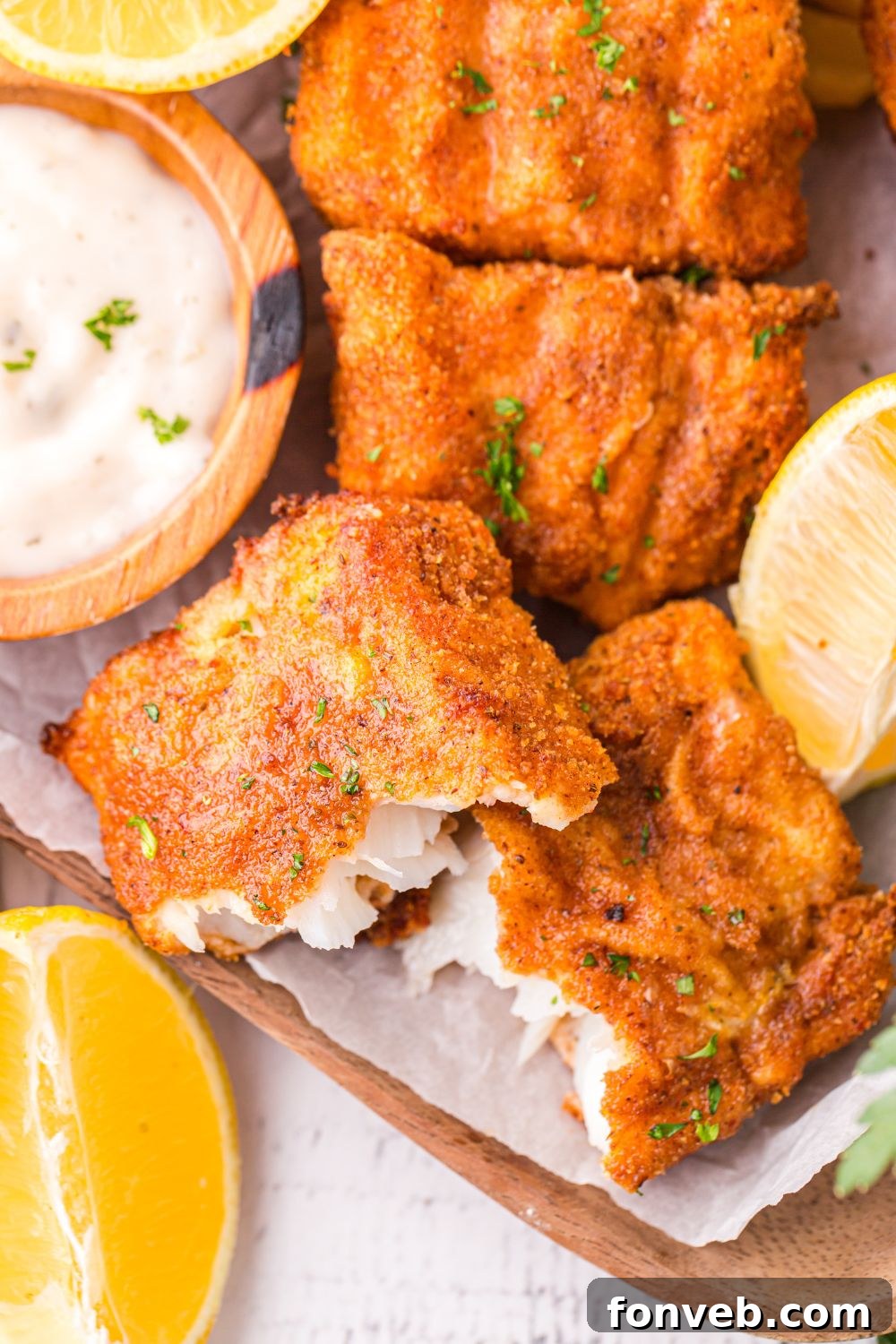 Crispy Air-Fried Fish and Chips 19 fish broke in half showing the flaky fish centers of the crispy fish fillets
