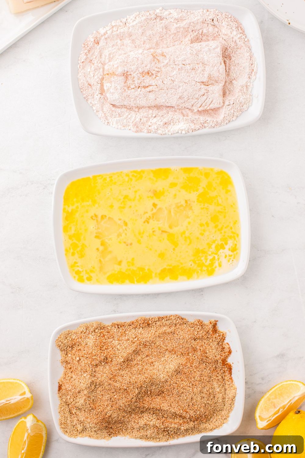 Crispy Air-Fried Fish and Chips 8 dredging fish in flour in a small bowl