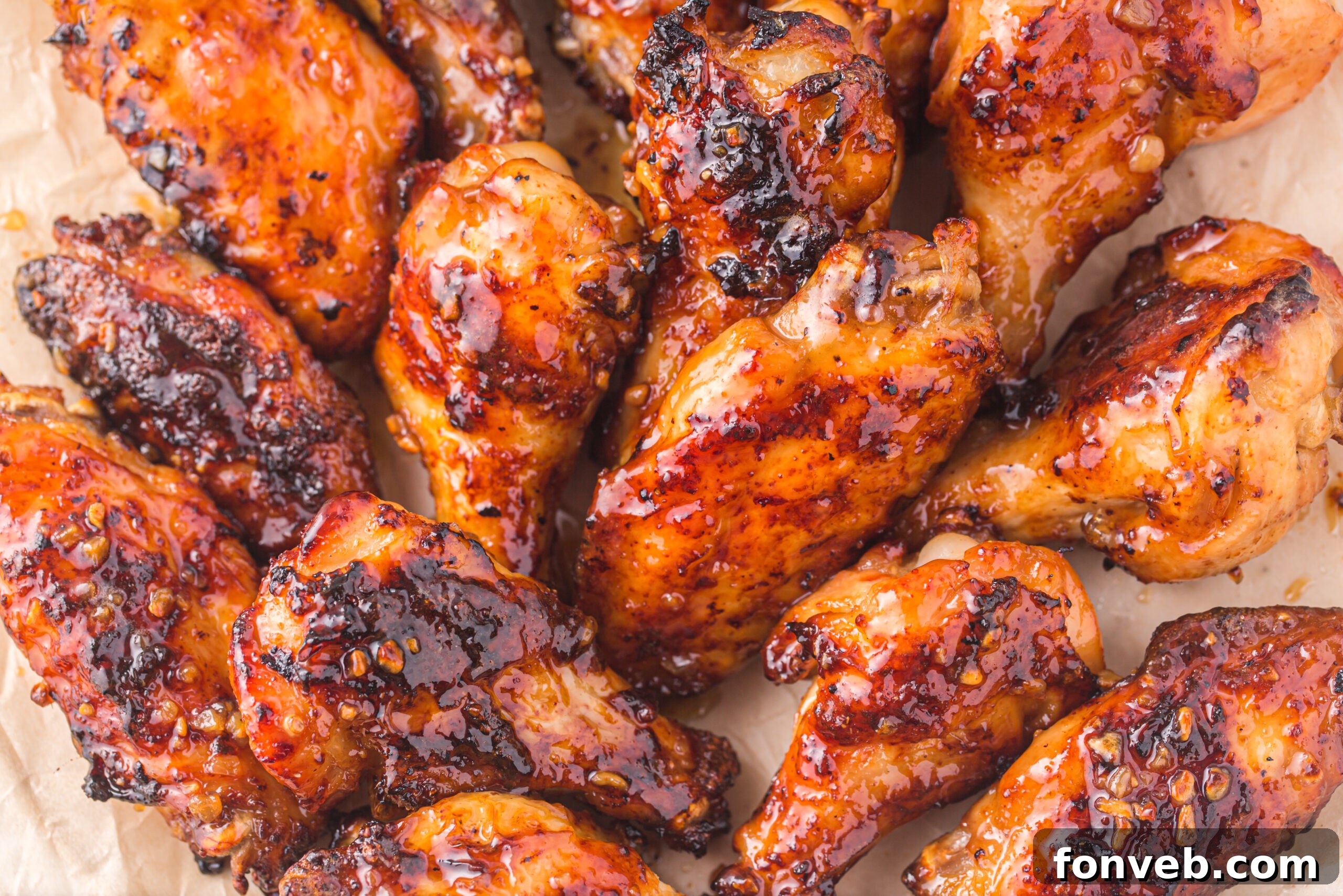 overhead shot of the Air Fryer Honey Garlic Chicken Wings on parchment paper 