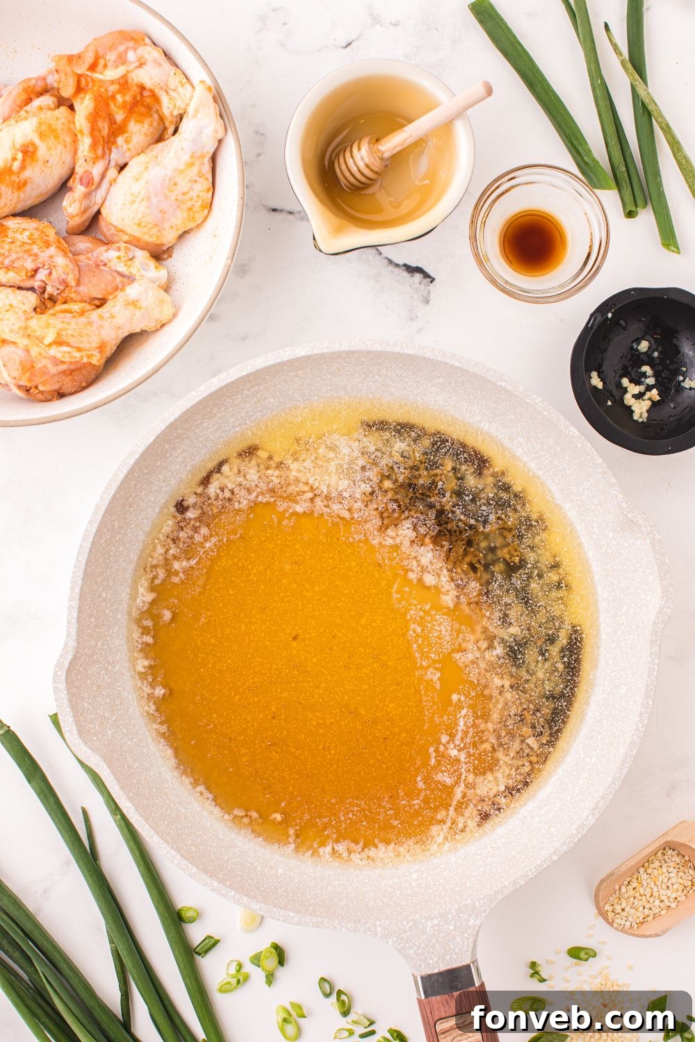 honey garlic sauce in a bowl with more ingredients to add into the small bowl 