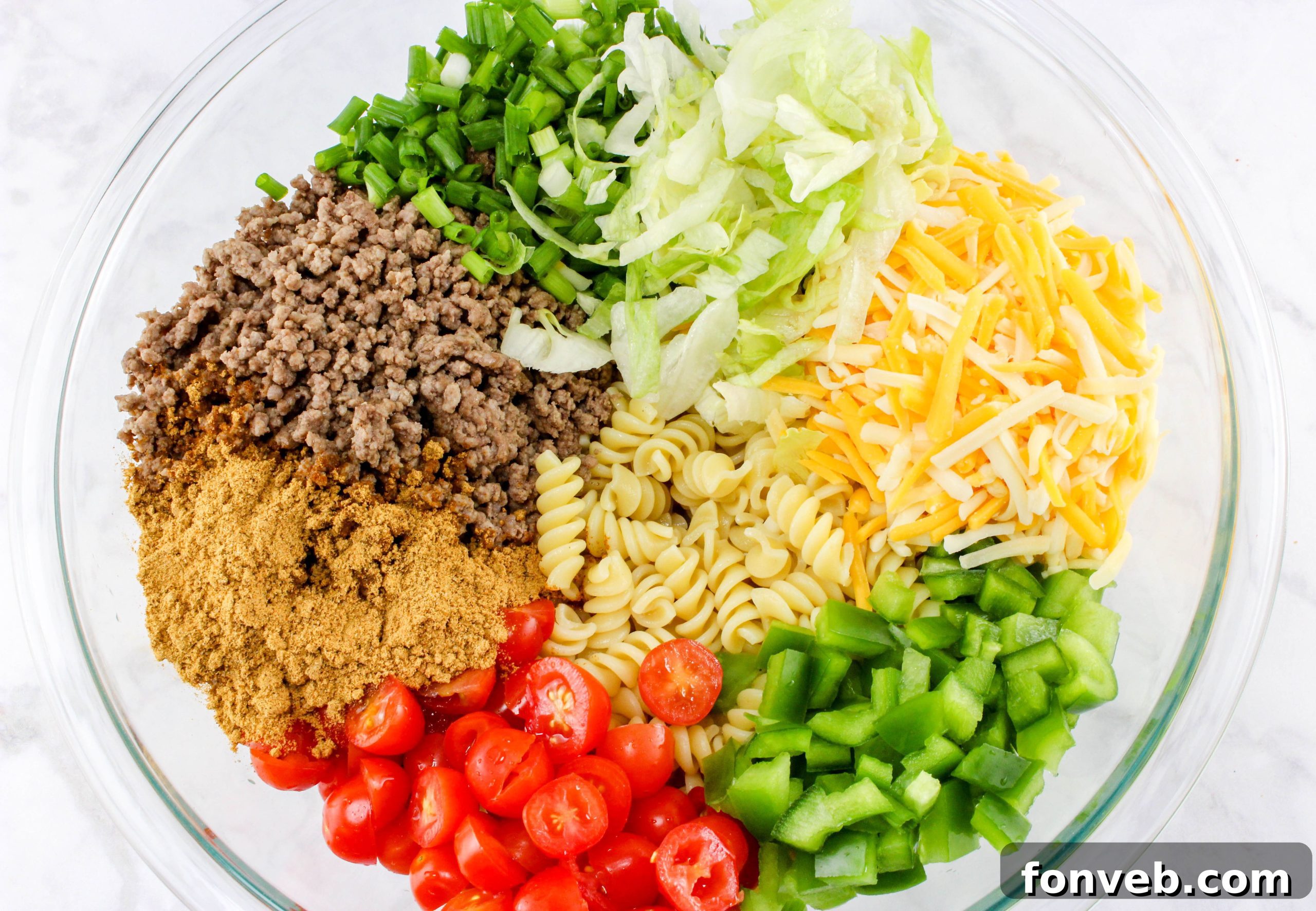 Close-up of the taco pasta salad with creamy dressing and vibrant greens.